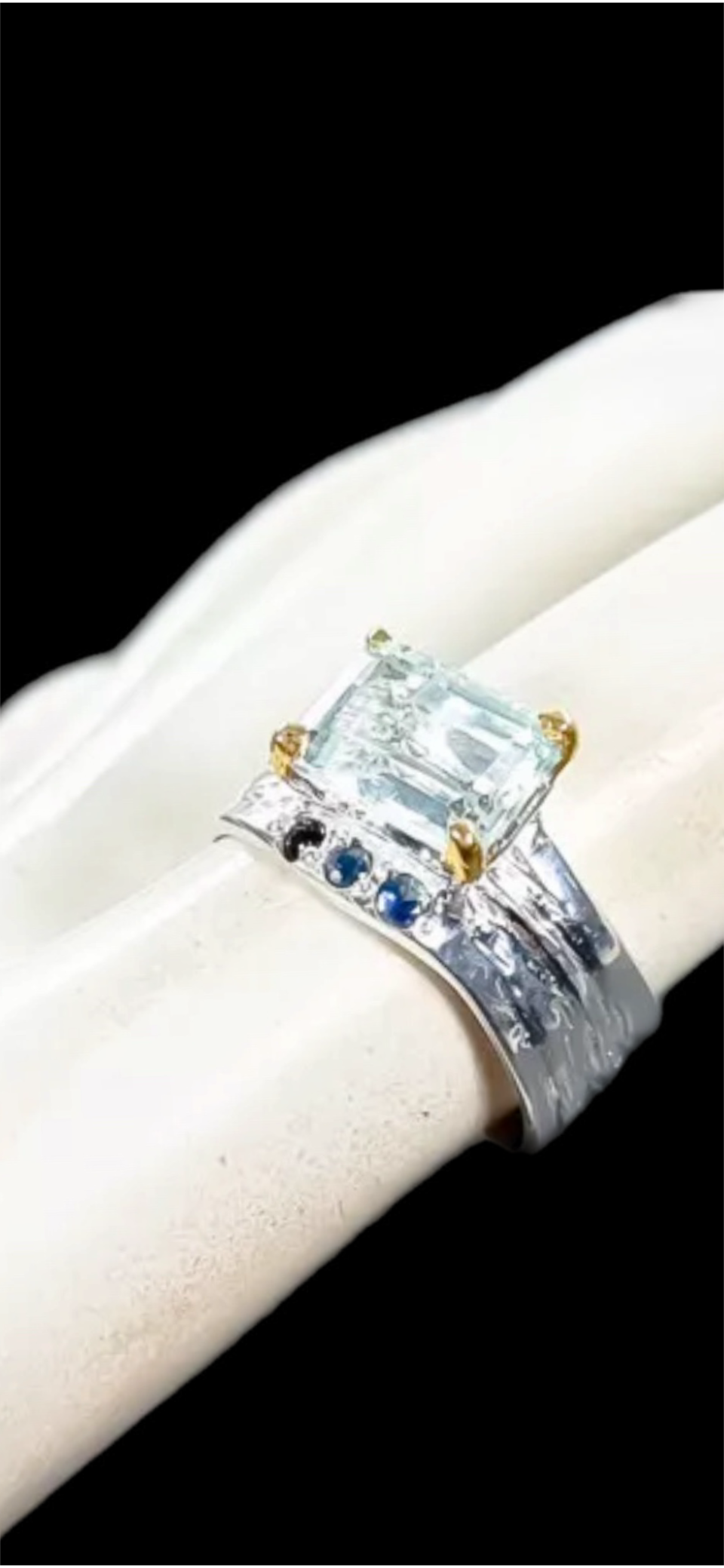 Genuine Aquamarine Accented with Sapphires.