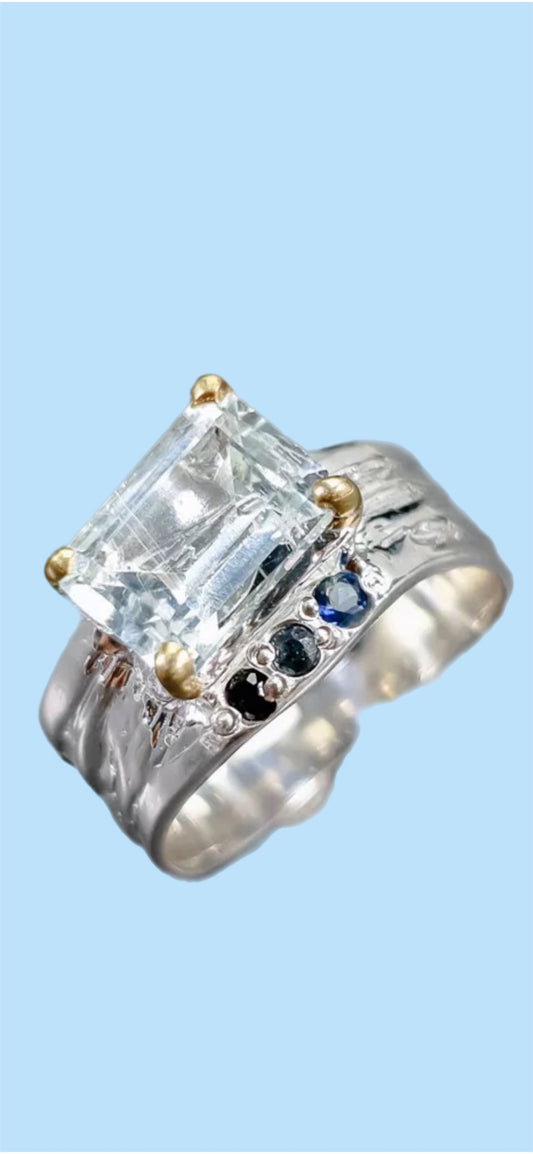 Genuine Aquamarine Accented with Sapphires.