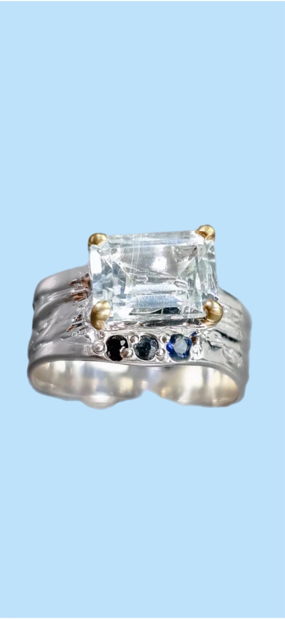 Genuine Aquamarine Accented with Sapphires.