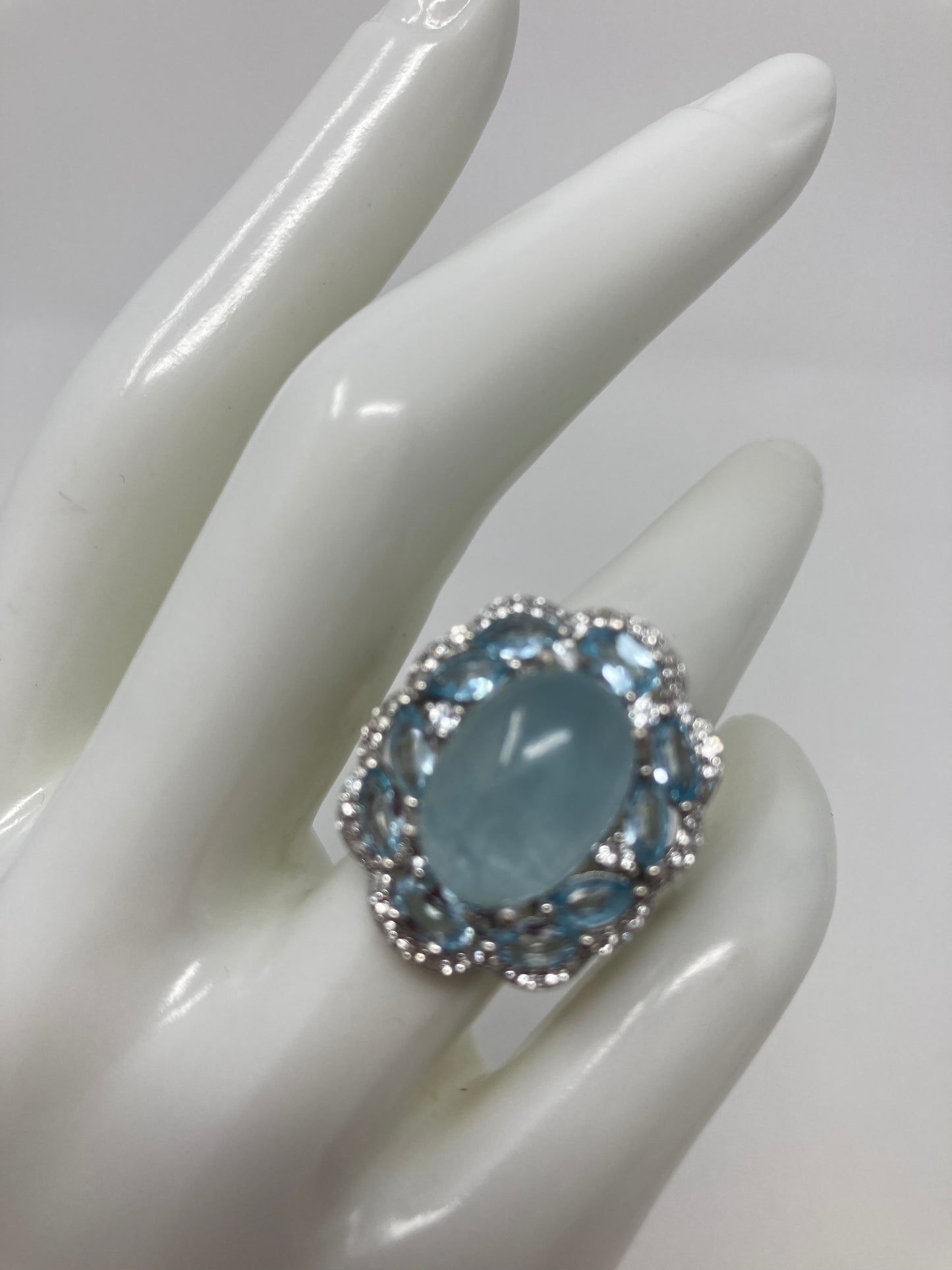 Rare 14mm by 10mm genuine Aquamarine Cabochon encrusted with Marquee shaped faceted Aquamarines