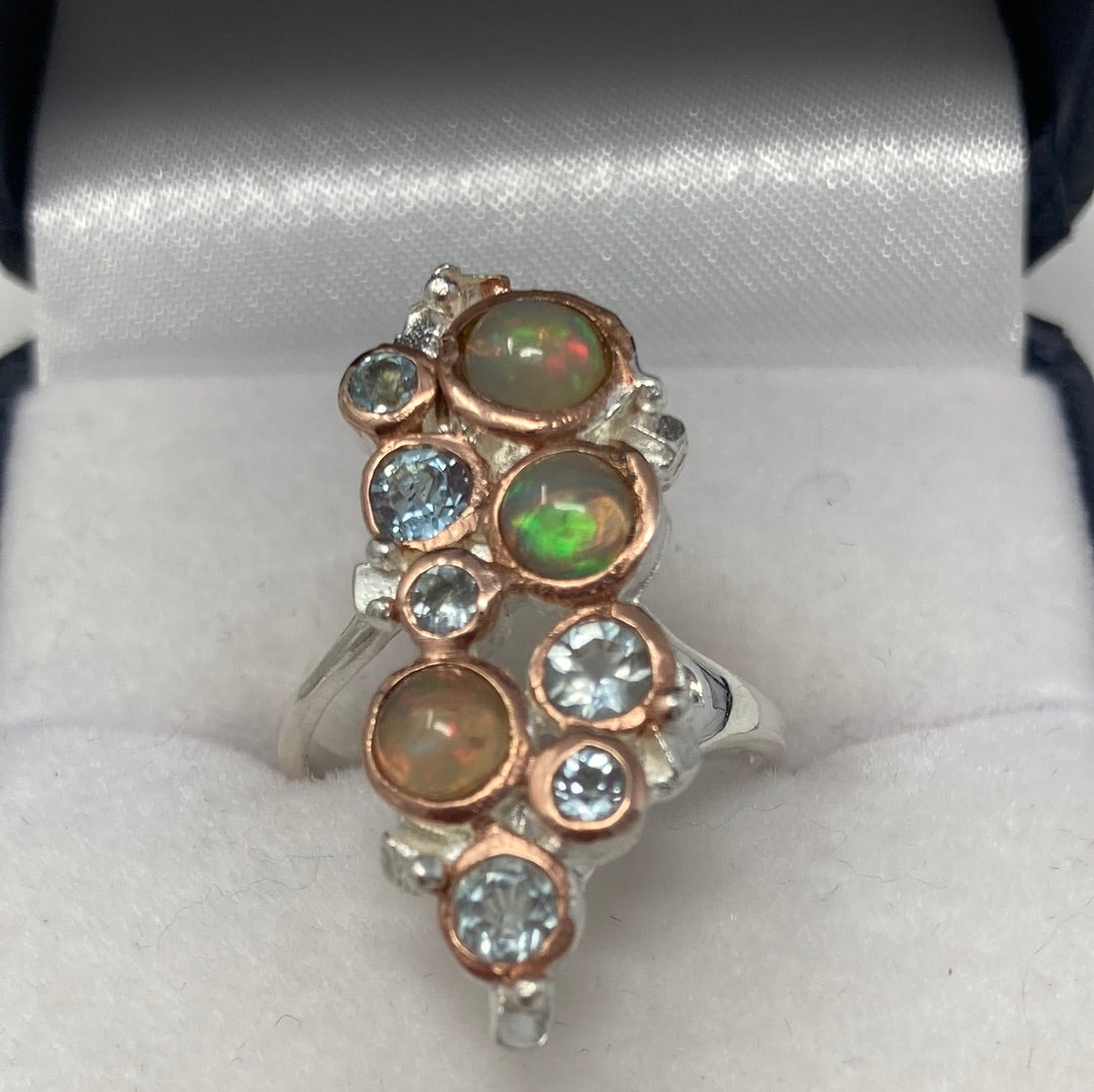 Genuine Opals and Blue Topaz Ring