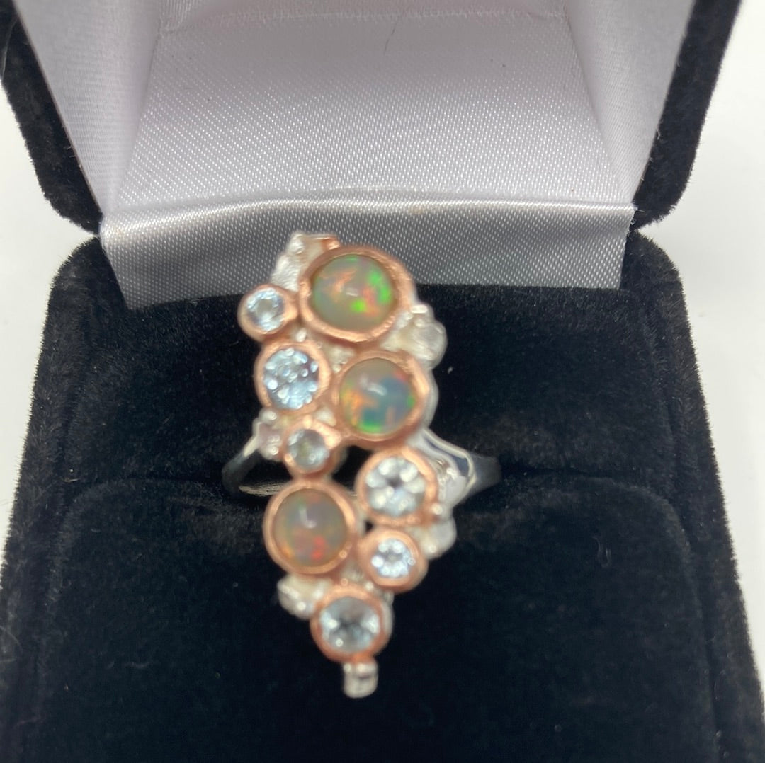 Genuine Opals and Blue Topaz Ring