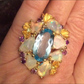 Over The Top Genuine Blue Topaz and Opal Ring